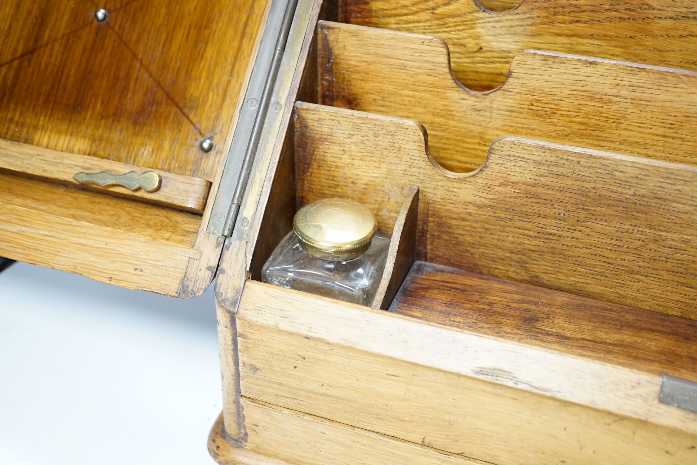 An Edwardian oak stationery casket, 31cm high, 38cm wide, 21.5cm deep